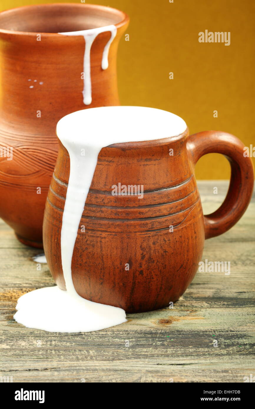 https://c8.alamy.com/comp/EHH7DB/ceramic-mug-with-cream-and-clay-jug-EHH7DB.jpg