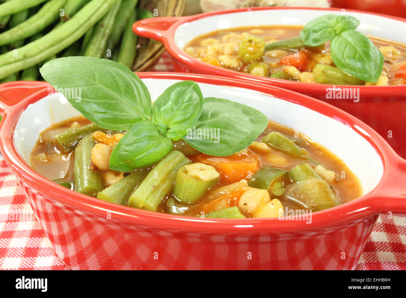 Minestrone with fresh basil Stock Photo Alamy
