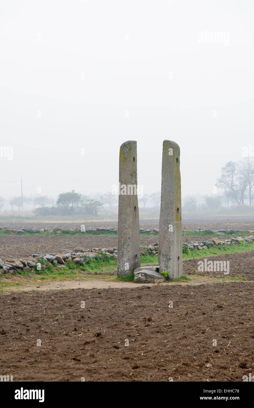 A set of two stone flagpole .called Dangganjiju. to infrom the temple. Stock Photo