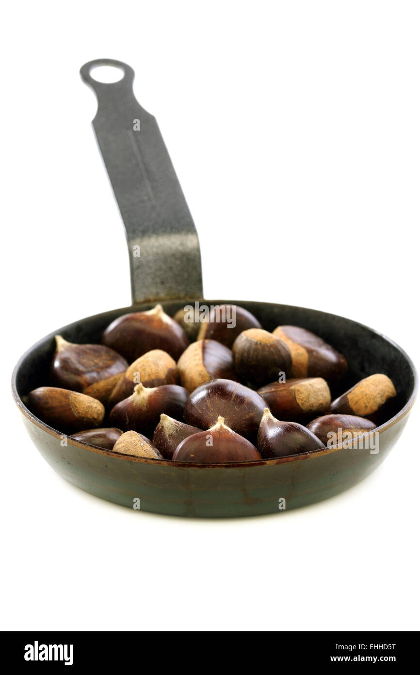 Chestnuts roasting in a pan. Stock Photo