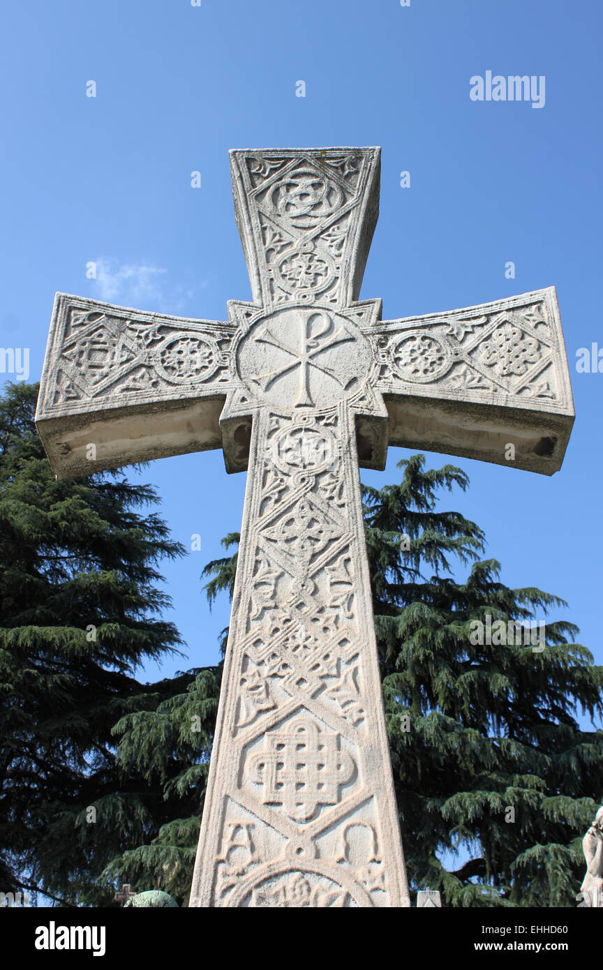 Cross gravestone in a graveyard Stock Photo