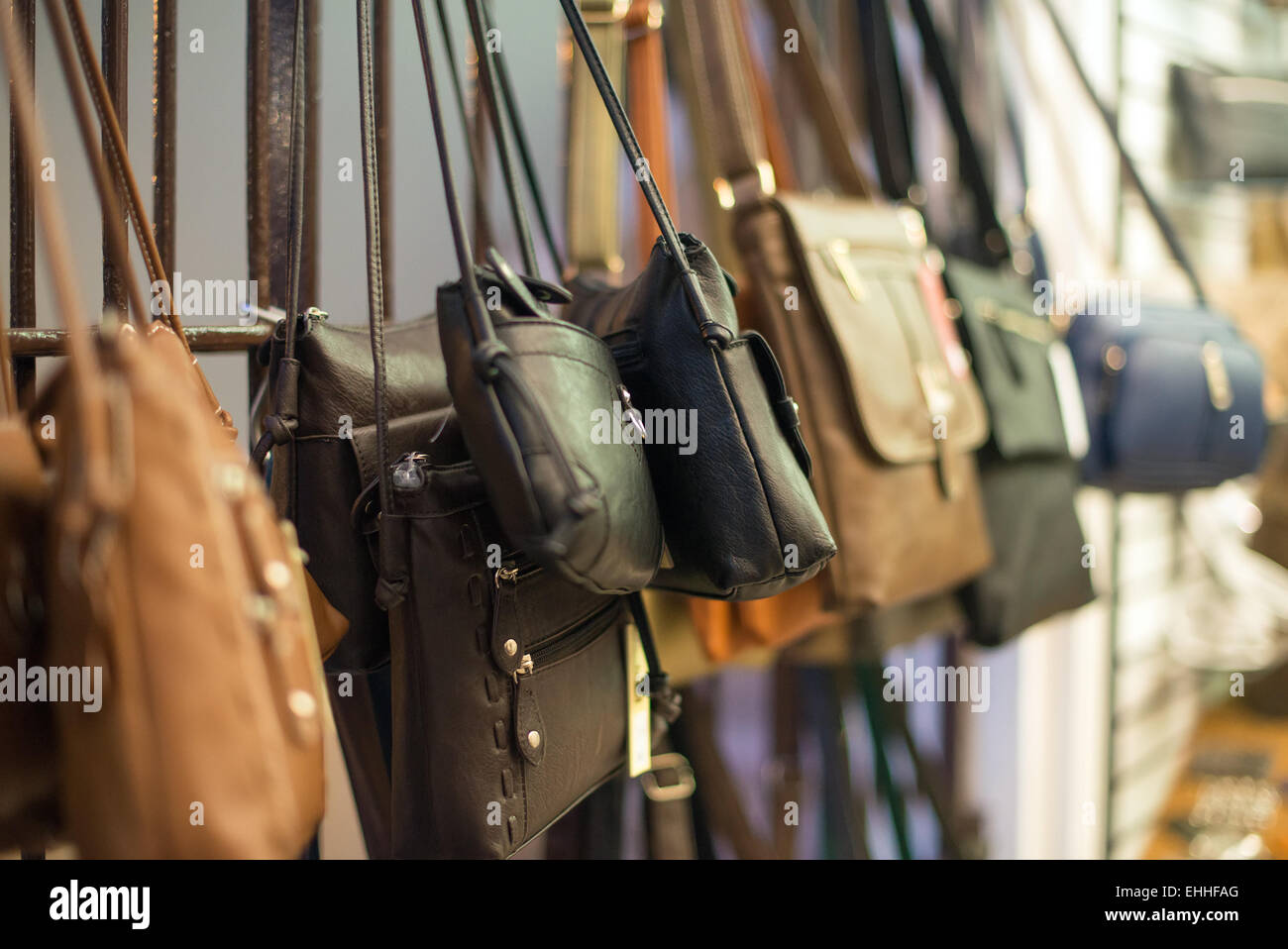 Leather handbags collection in the store. Stock Photo