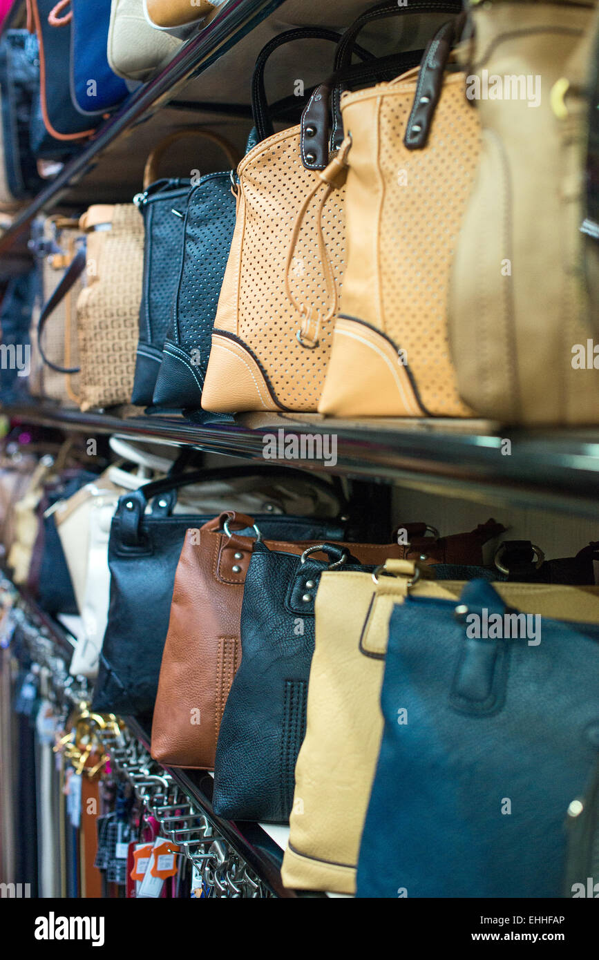 Leather handbags collection in the store. Stock Photo
