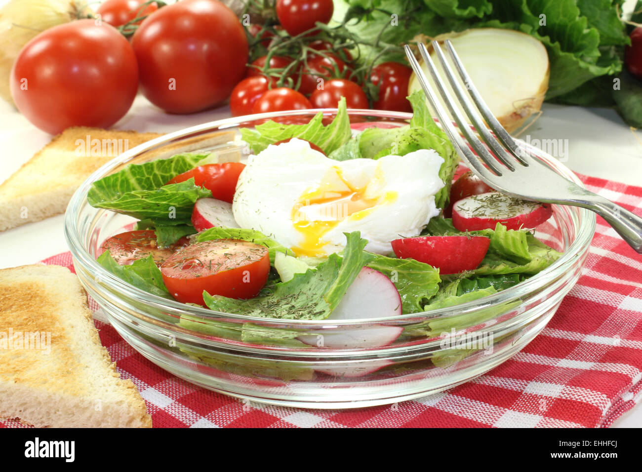 salad with poached egg, onions and radishes Stock Photo
