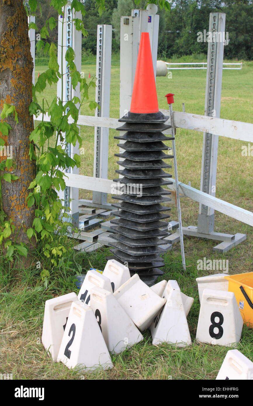 Red cones used for equitation obstacles Stock Photo