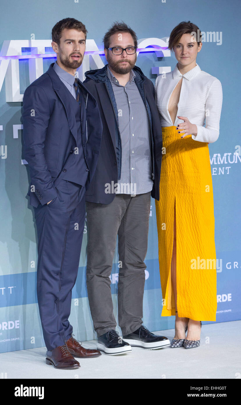 Berlin, Germany. 13th Mar, 2015. Actors Shailene Woodley (L), Theo James (R) and film director Robert Schwentke (C) arrive for the premiere of their new film 'Insurgent' in Berlin, Germany, 13 March 2015. The film starts in cinemas around Germany on 19 March 2015. Photo: Joerg Carstensen/dpa/Alamy Live News Stock Photo