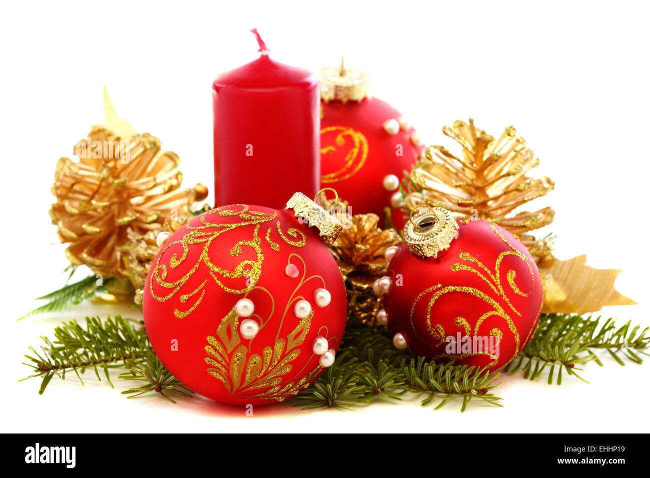 Christmas balls, candles and pine cones. Stock Photo