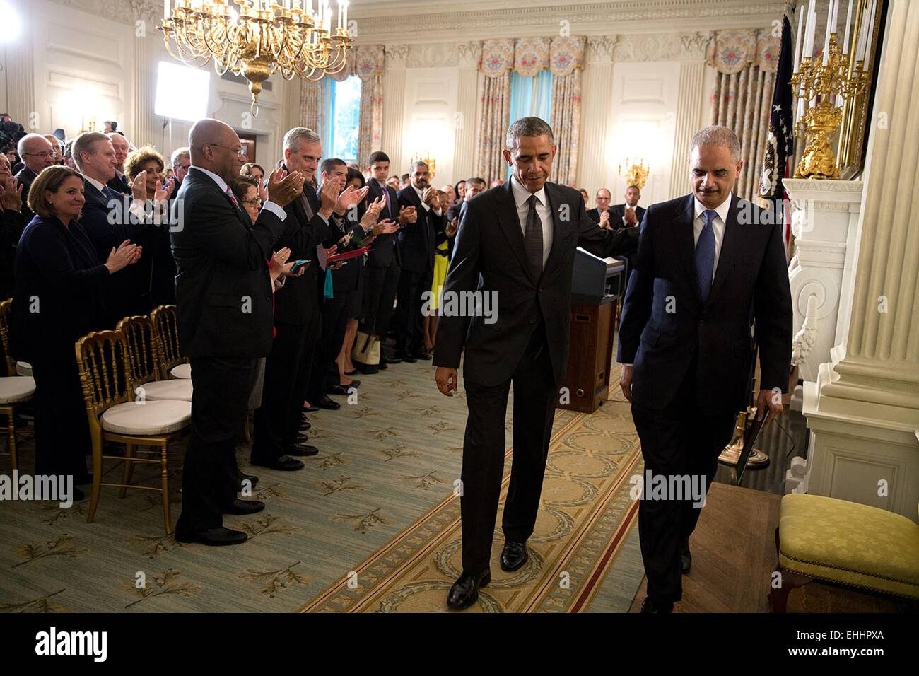US President Barack Obama and Attorney General Eric H. Holder, Jr. walk together following Holder's resignation in the State Dining Room of the White House September 25, 2014 in Washington, DC. Stock Photo