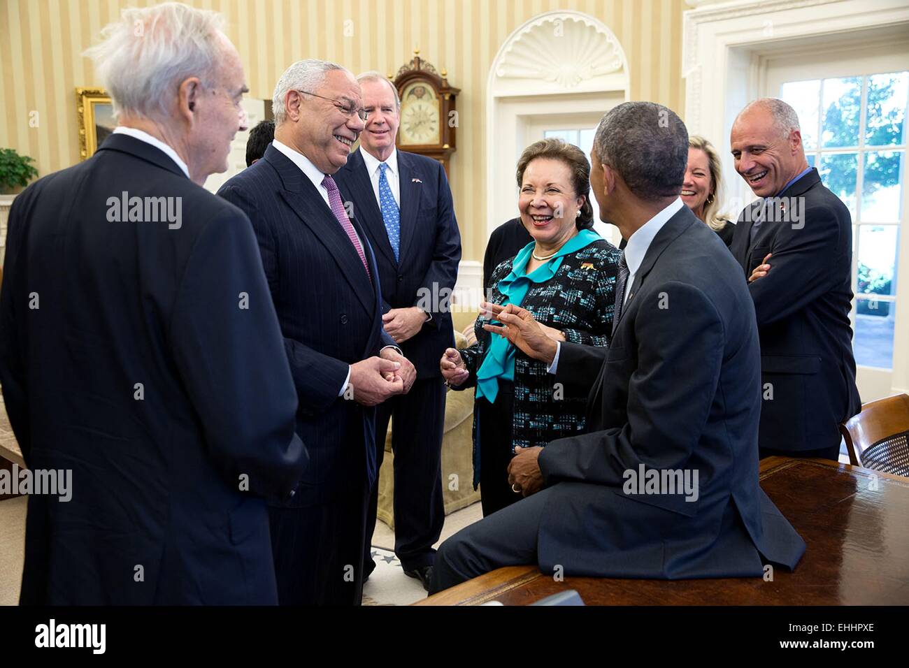 US President Barack Obama visits with General Colin Powell and his wife Alma after he signed the America's Promise Summit Declaration in the Oval Office off the White House September 22, 2014 in Washington, DC.. Attendees from left: Former Senator Harris Wofford, Gen. Colin Powell, Vice-Chair America's Promise Alliance Gregg Petersmeyer, Chair America's Promise Alma Powell and President and CEO, America's Promise Alliance John Gomperts. Stock Photo