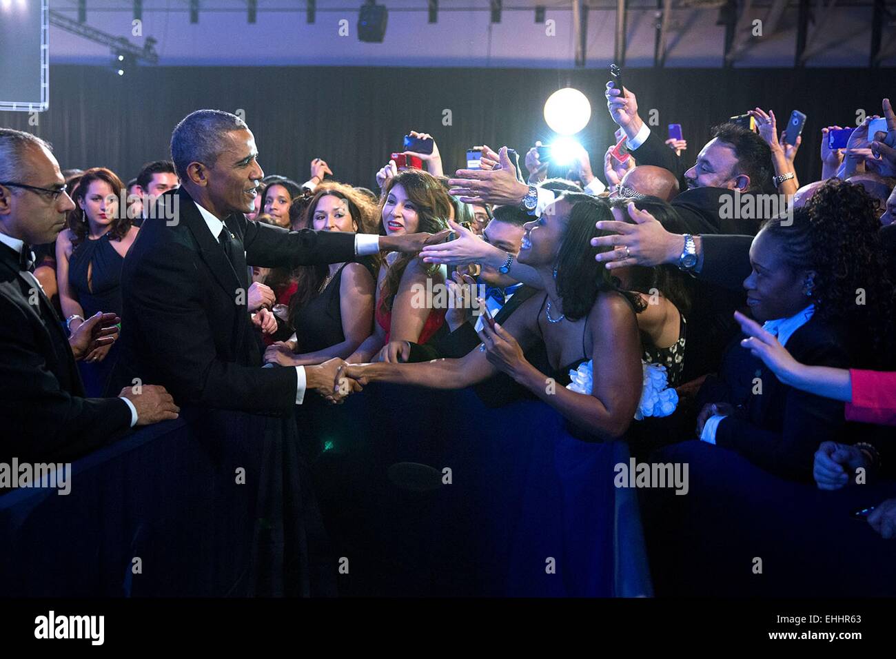 US President Barack Obama greets audience members at the Congressional Hispanic Caucus Institute's 37th Annual Awards Gala dinner at the Walter E. Washington Convention Center October 2, 2014 in Washington, DC. Stock Photo