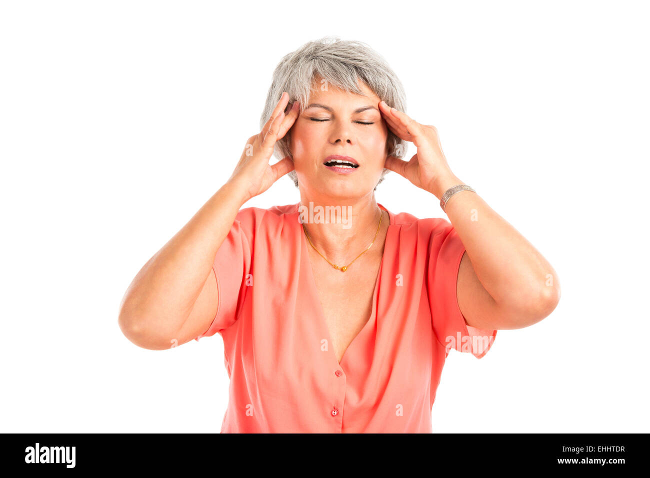 Portrait of a elderly woman with a headache, isolated on a white background Stock Photo