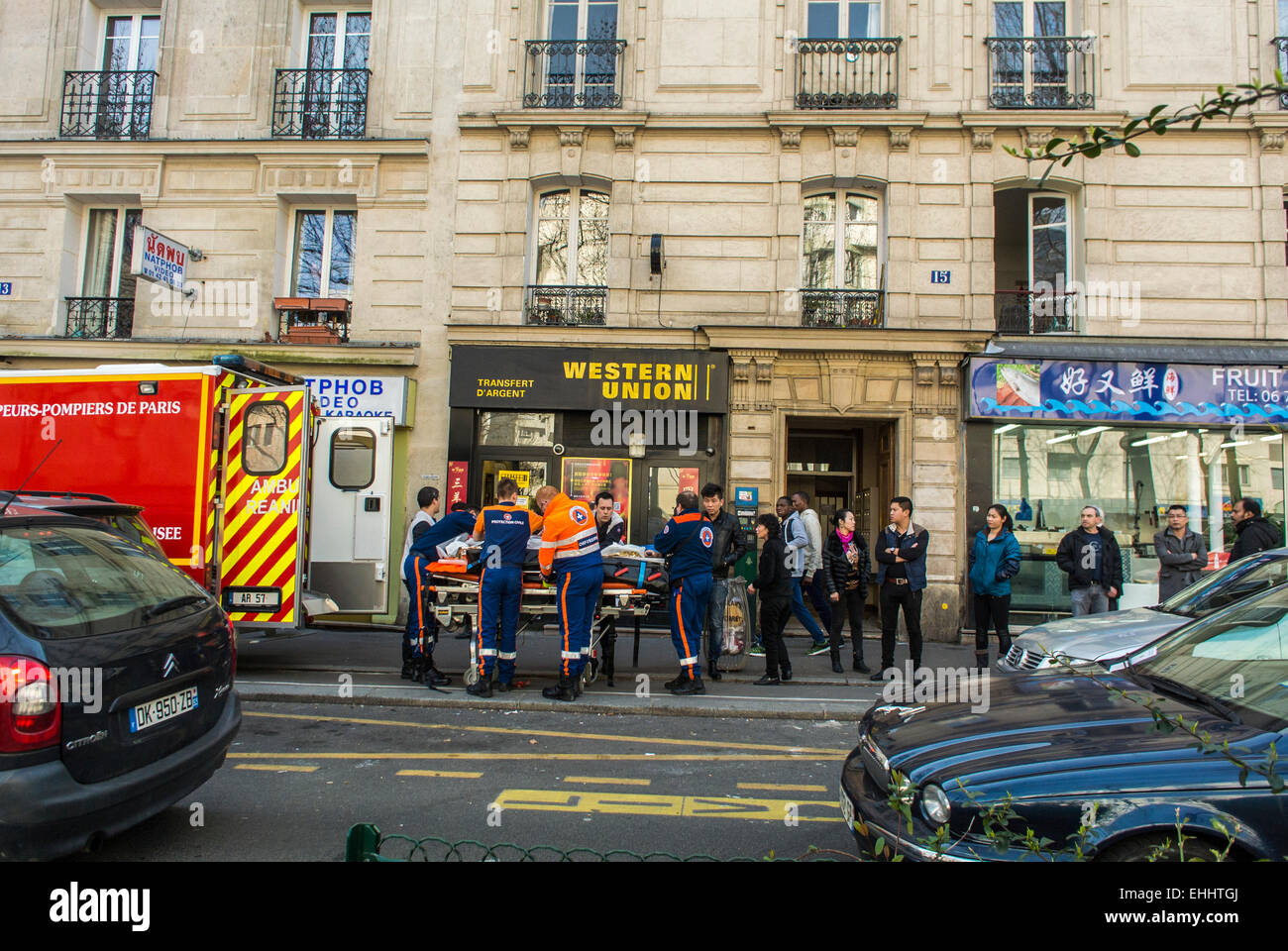 Paris France Chinese People Watching Firemen Emergency Crew Removing Accident Victim From Building In Chinatown Street Scenes Belleville District Stock Photo Alamy