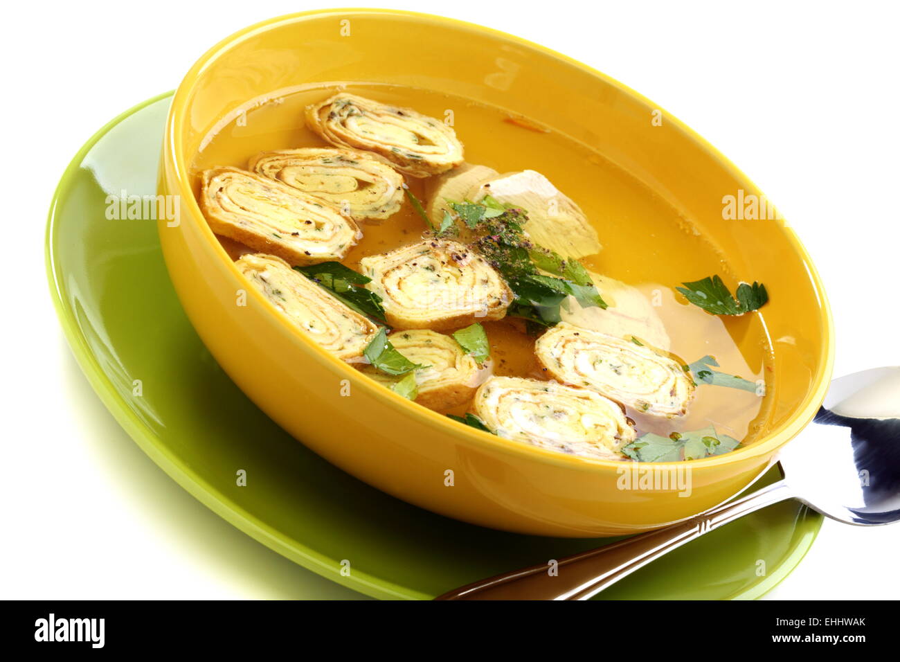 Chicken broth with rolls of omelet. Stock Photo