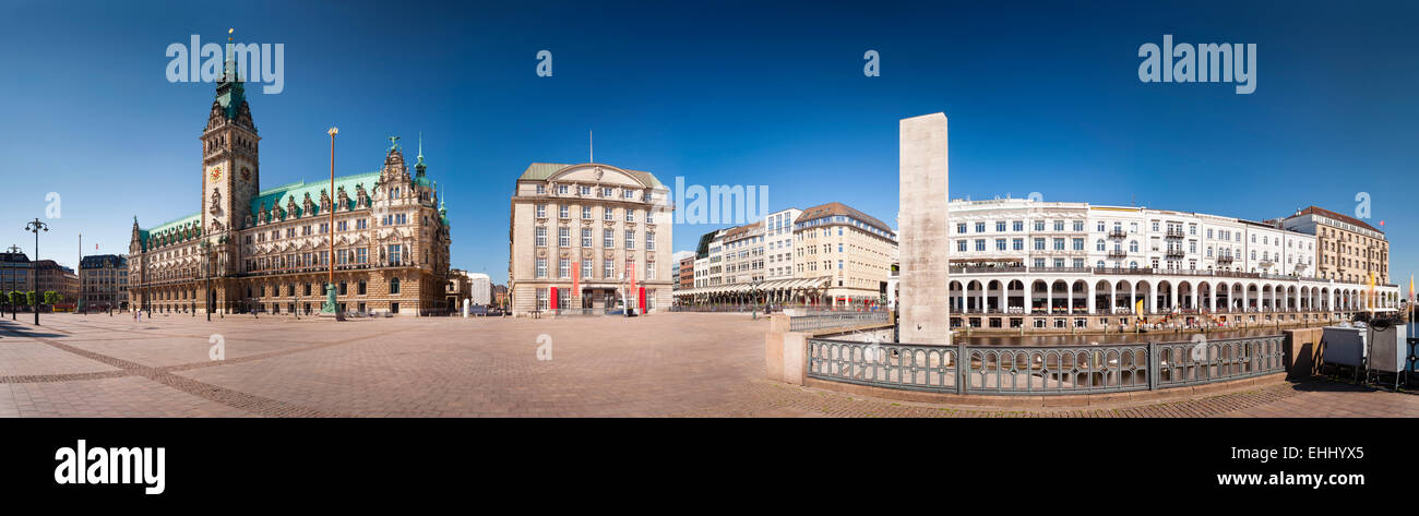 Panoramic view of the famous town hall and the Alsterarkaden in Hamburg, Germany as daytime long exposure shot Stock Photo