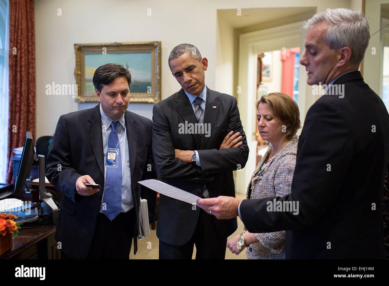 US President Barack Obama talks with Ebola Response Coordinator Ron Klain, Lisa Monaco, Assistant to the President for Homeland Security and Counterterrorism, and Chief of Staff Denis McDonough in the Outer Oval Office of the White House October 24, 2014 in Washington, DC. Stock Photo