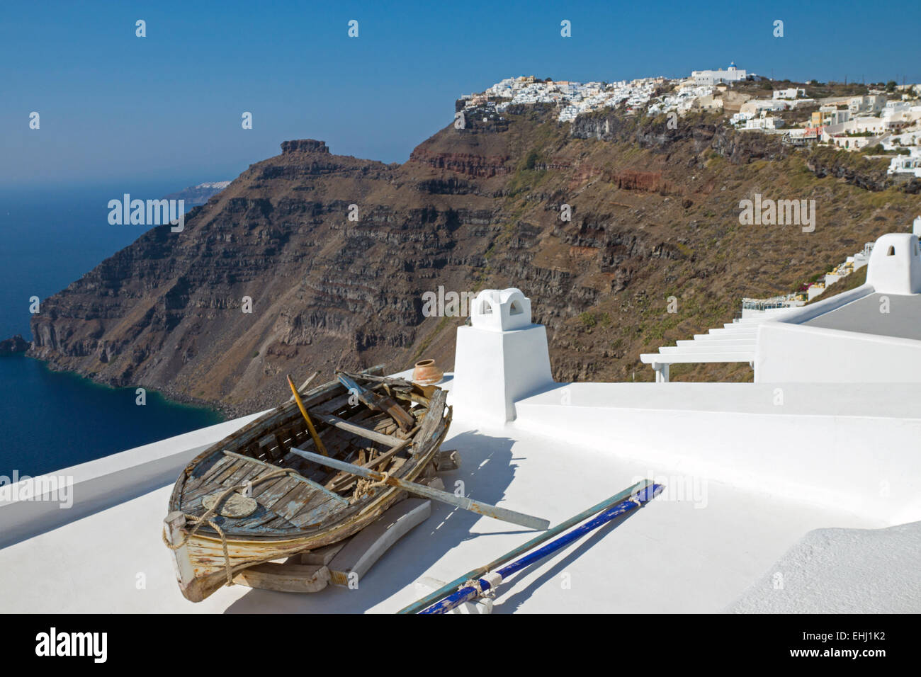 Boat and Imerovigli, Santorini island Stock Photo