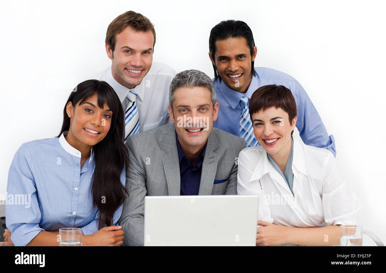 Multi-ethnic business group using a laptop Stock Photo - Alamy