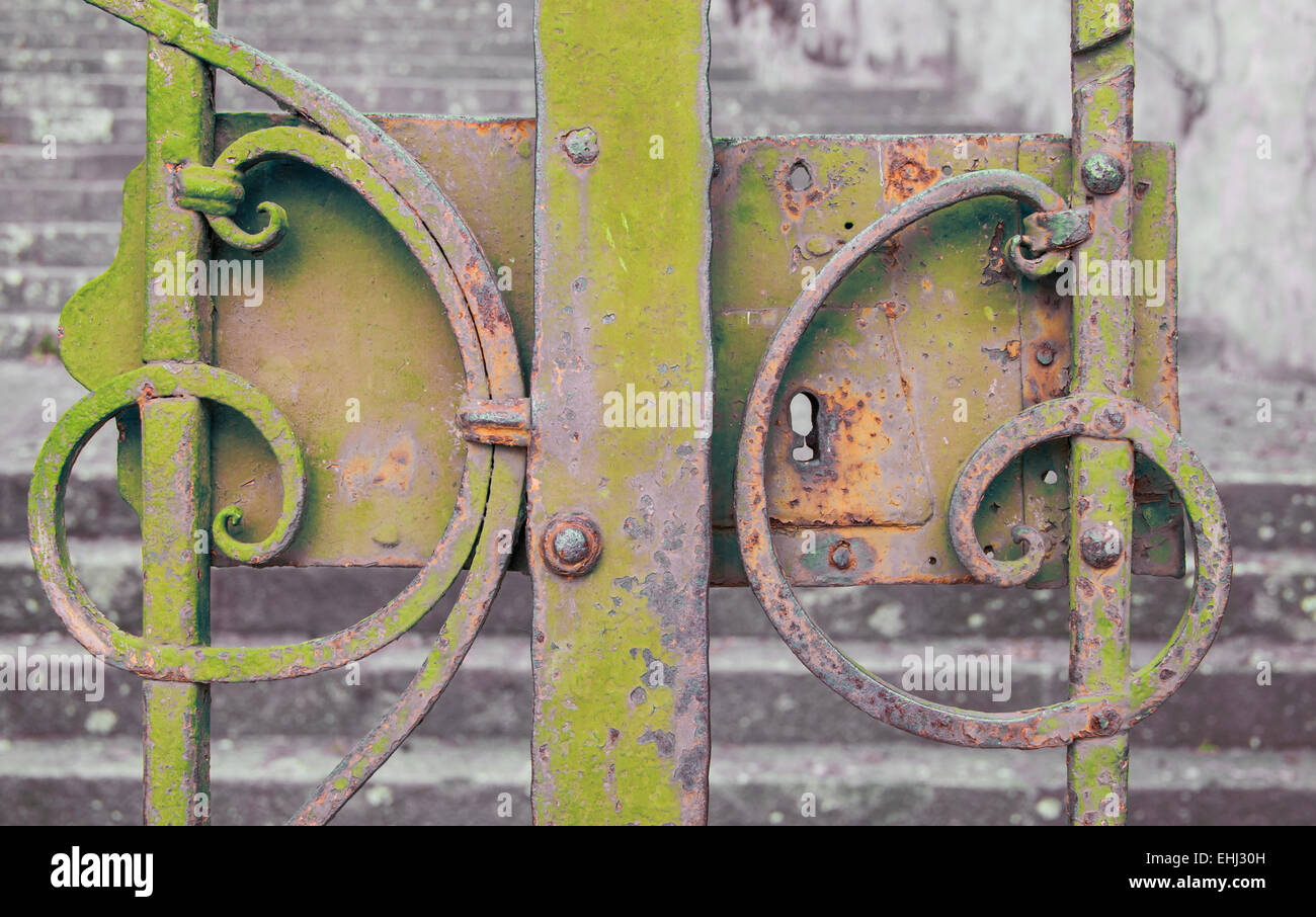 Yellow iron gate closed Stock Photo Alamy