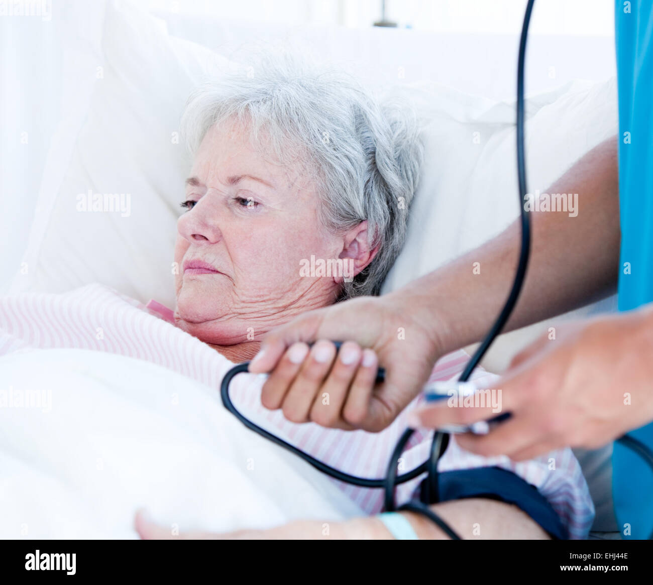 Sick senior woman lying on a hospital bed Stock Photo Alamy