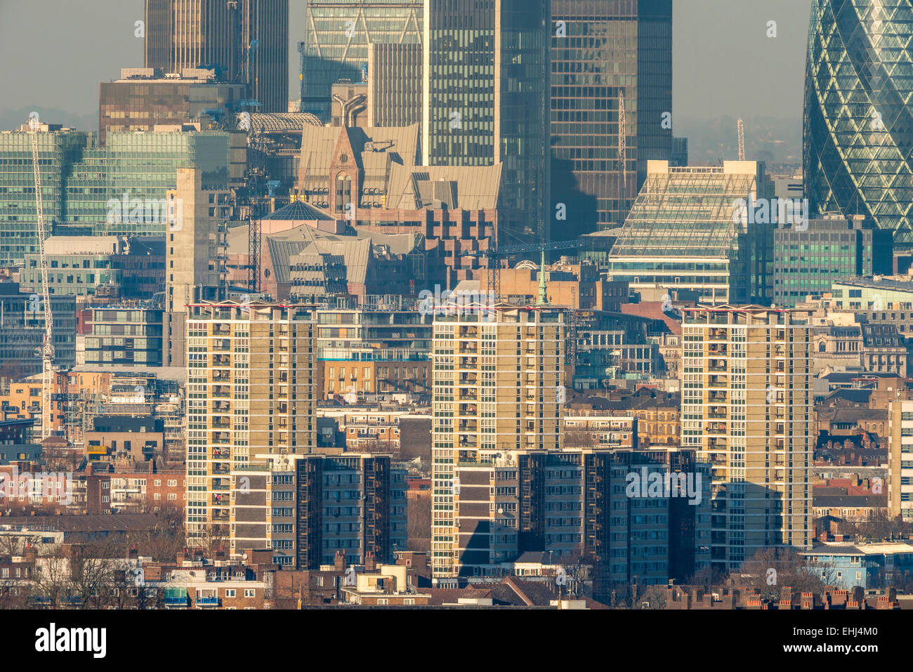 A dense urban scene of high rise flats and the rooftops of south London looking north towards the City of London Stock Photo