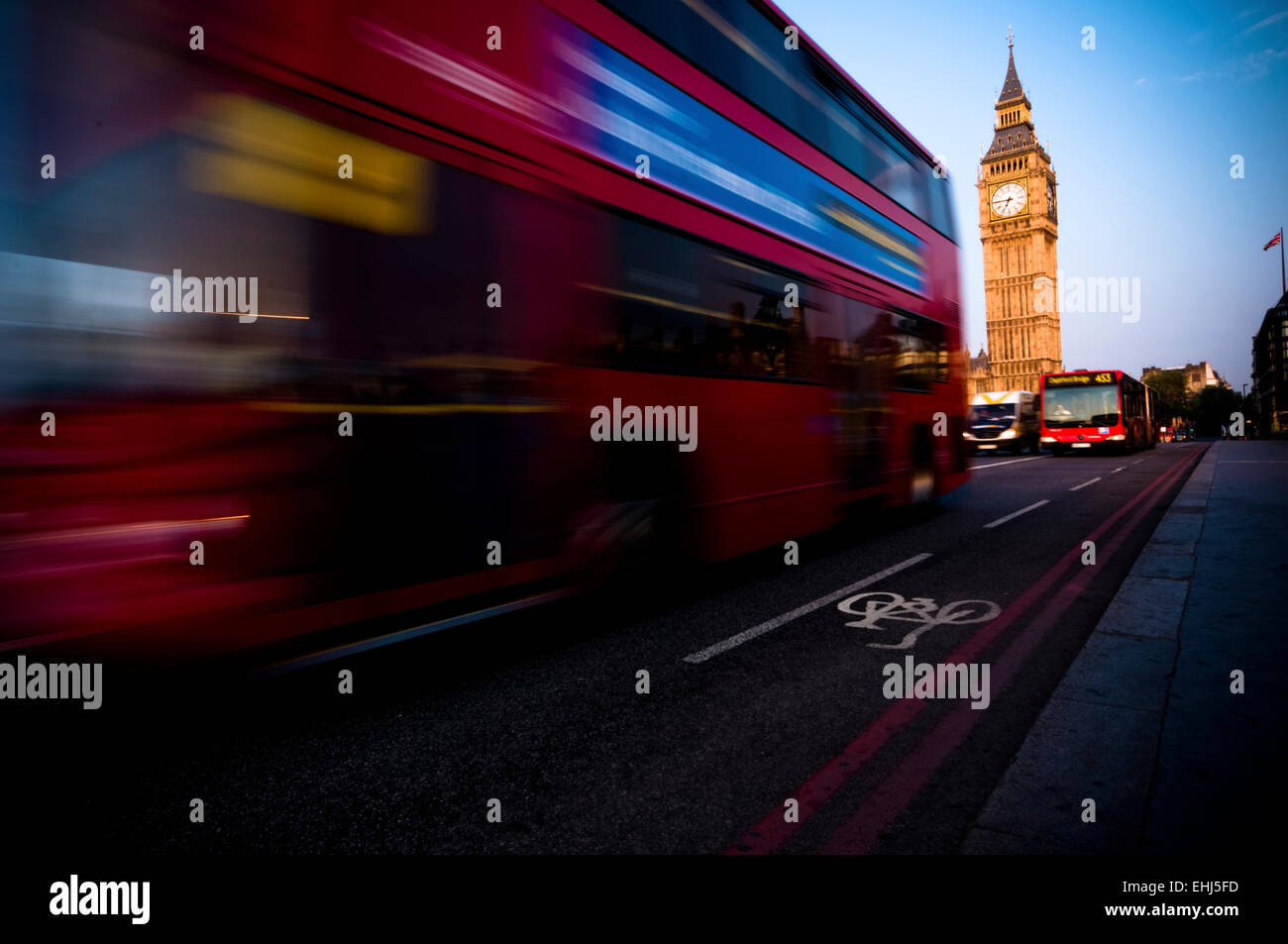 Early morning shot of Big Ben and double decker bus. Stock Photo