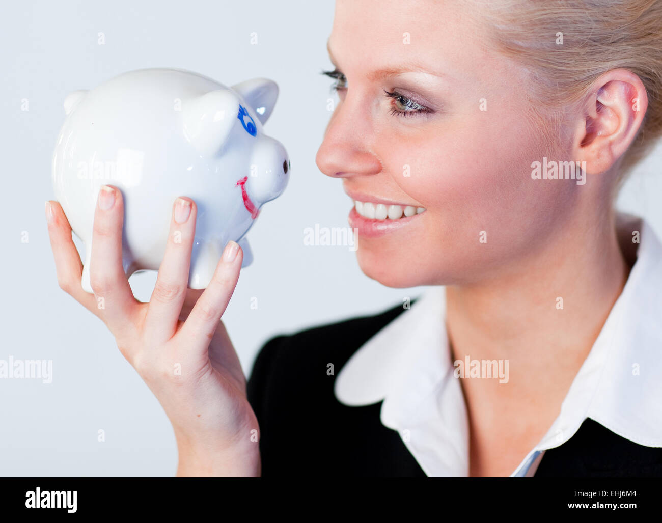 Business woman holding a piggy Bank Stock Photo - Alamy