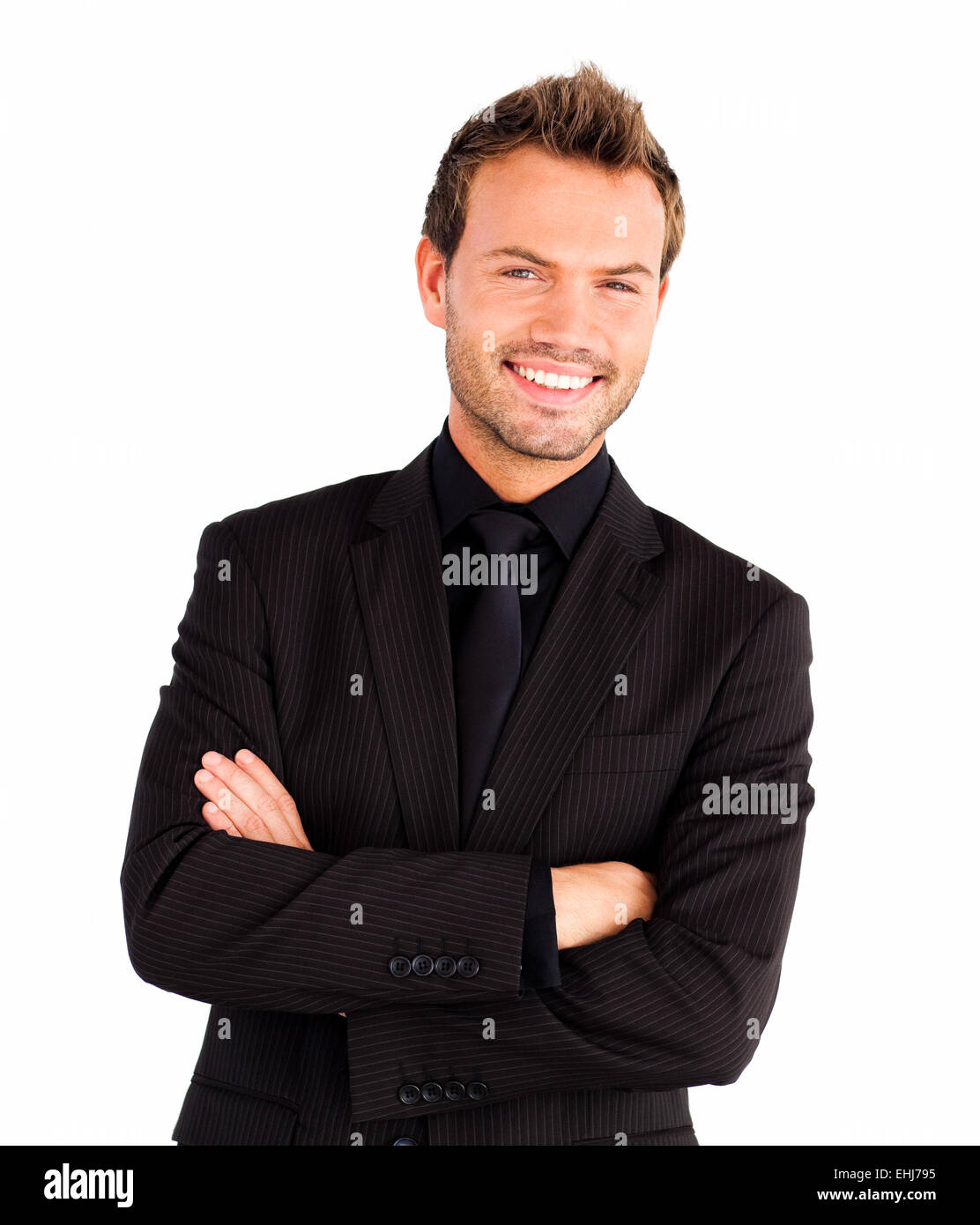 Happy businessman with crossed arms Stock Photo - Alamy