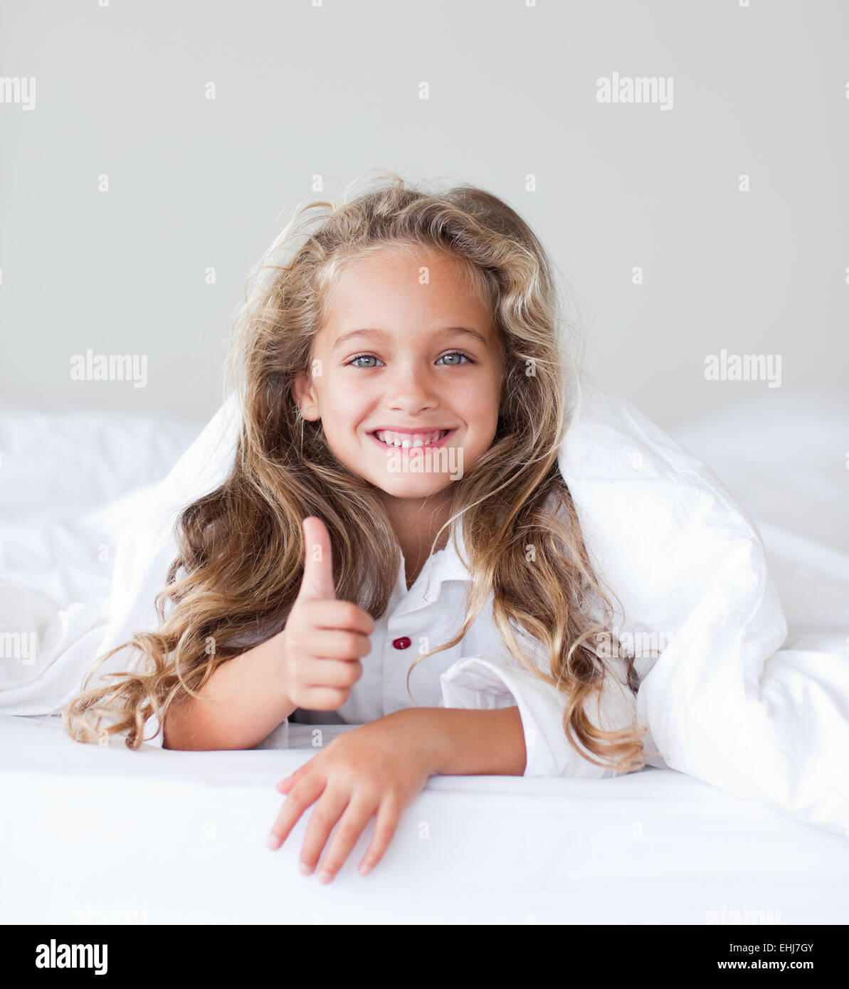 Portrait of a beautiful girl thumbs up Stock Photo - Alamy