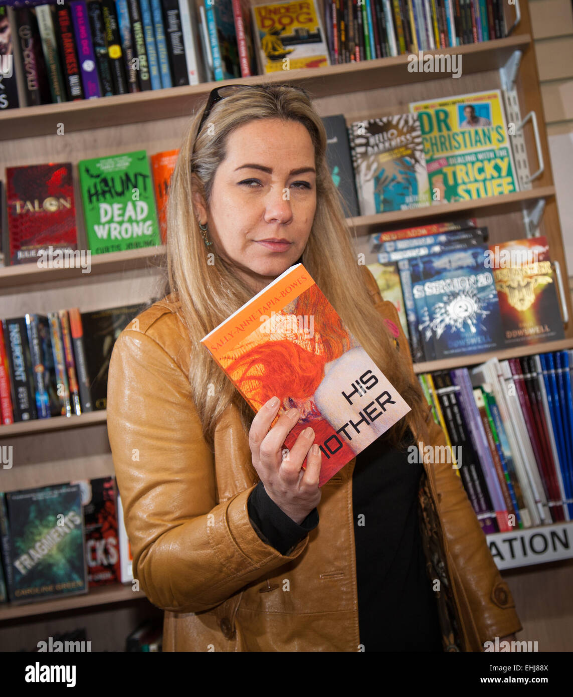 Formby, Southport, Merseyside UK. 14th March, 2015. Sally-Anne Tapia-Bowes book signing at Formby Books. Sally-Anne Tapia-Bowes graduated at Hope University with a degree in English Literature and Contemporary Art. She is a past employee of Pearson Edexcel having worked as a Principal Examiner for G.C.S.E. English Literature and Chief Examiner for I.G.C.S.E. English Literature.  HIS MOTHER is her debut crime novel with sequels HER FATHER and THEIR PARENTS to follow. Themes in this series include dysfunctional families, mental health, loss and regret. Stock Photo