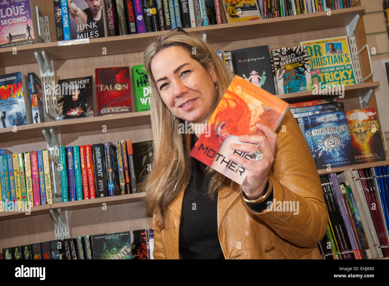 Formby, Southport, Merseyside UK. 14th March, 2015. Sally-Anne Tapia-Bowes book signing at Formby Books. Sally-Anne Tapia-Bowes graduated at Hope University with a degree in English Literature and Contemporary Art. She is a past employee of Pearson Edexcel having worked as a Principal Examiner for G.C.S.E. English Literature and Chief Examiner for I.G.C.S.E. English Literature.  HIS MOTHER is her debut crime novel with sequels HER FATHER and THEIR PARENTS to follow. Themes in this series include dysfunctional families, mental health, loss and regret. Stock Photo