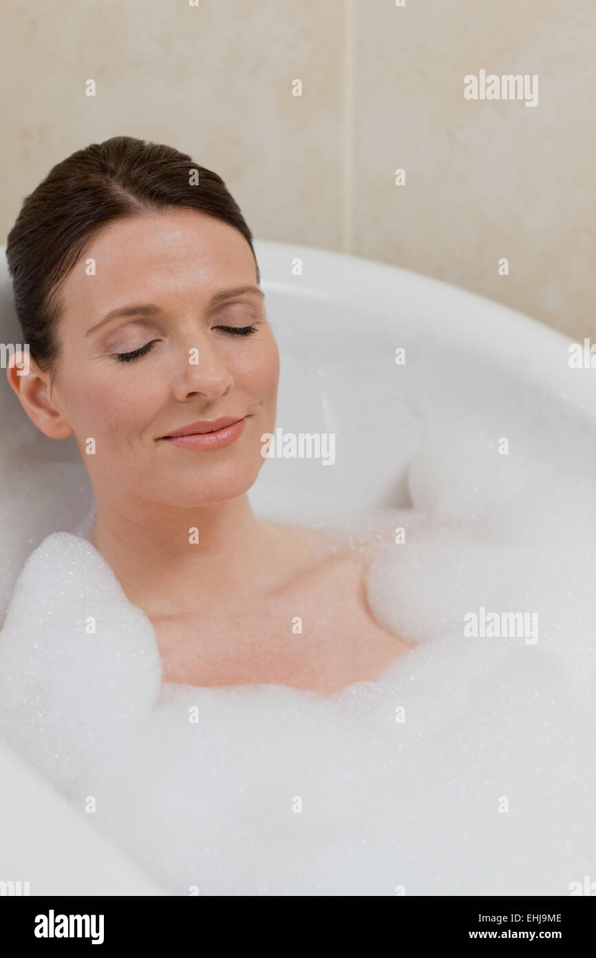 Beautiful woman taking a bath Stock Photo Alamy