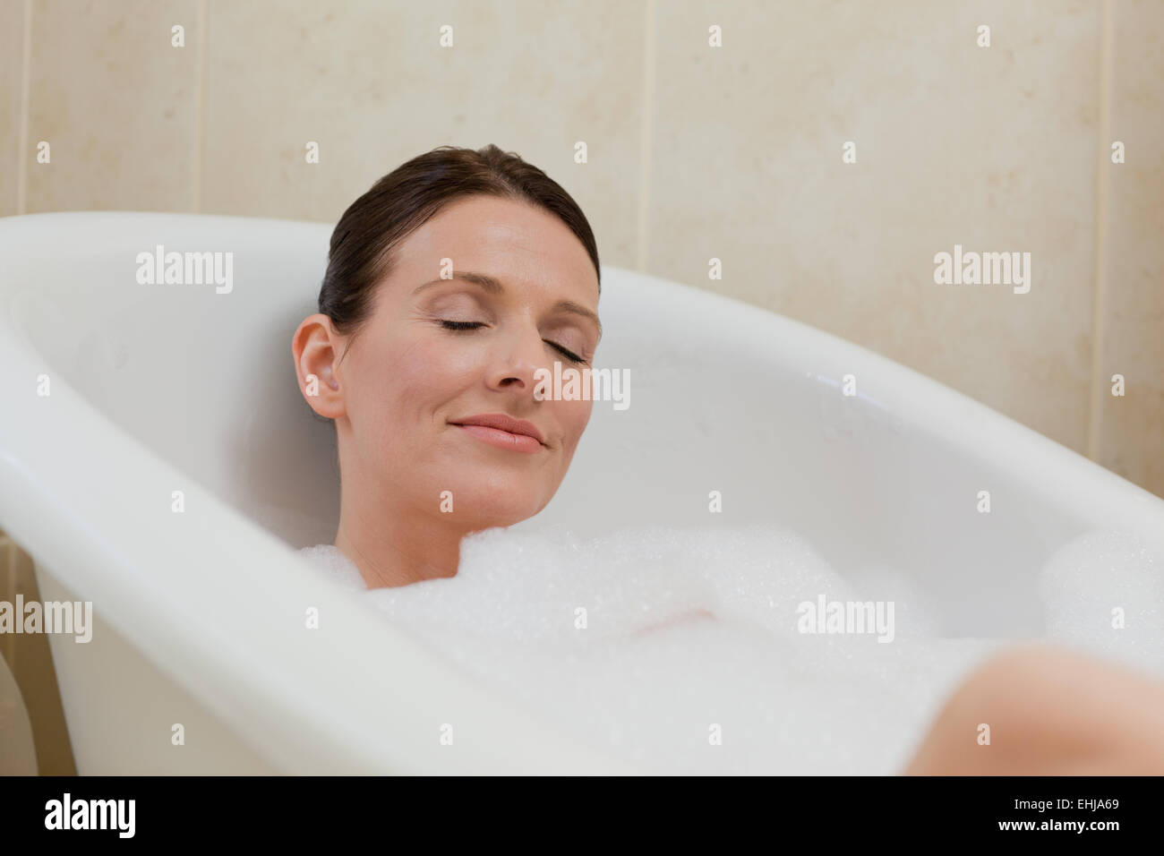 Beautiful woman taking a bath Stock Photo Alamy