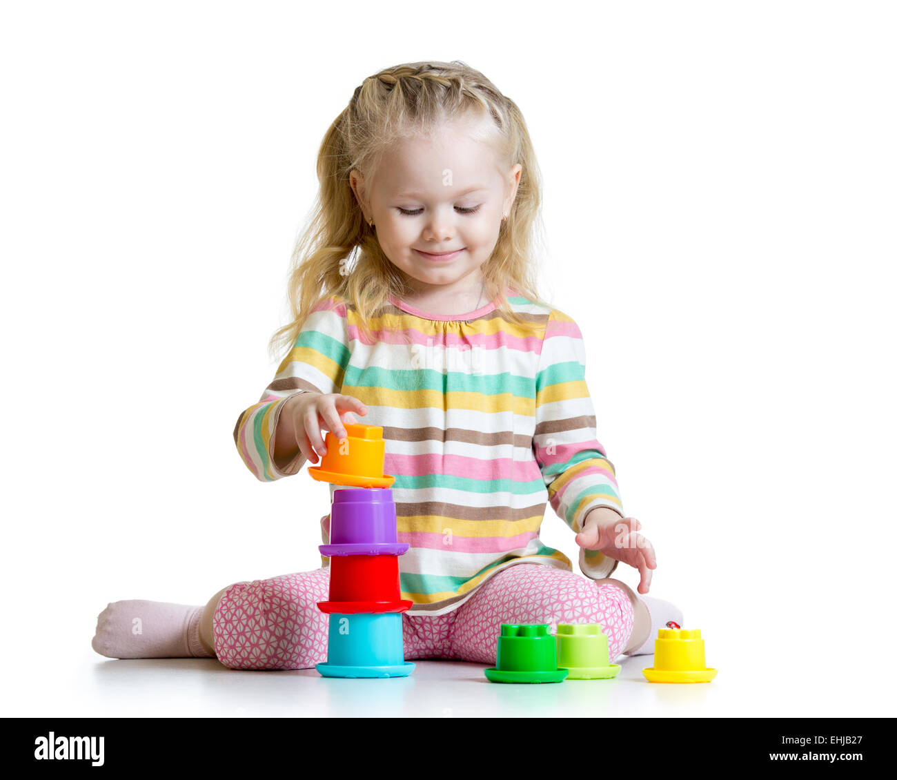 little girl playing with color toys Stock Photo - Alamy
