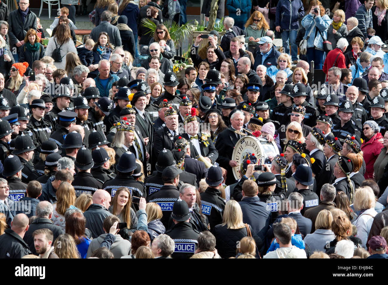 Falmouth, Cornwall, UK. 14th March 2015. Falmouth Marine band with a rendition of Trelawney, and  a crowd of 6000 people paying tribute to the hugely popular community beat officer PC Andy Hocking who suddenly died of a heart attack last week at the age of 52. Credit:  Simon Yates/Alamy Live News Stock Photo