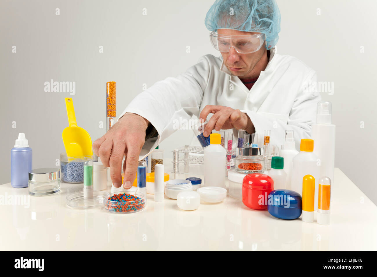 technician working with plastic granules Stock Photo