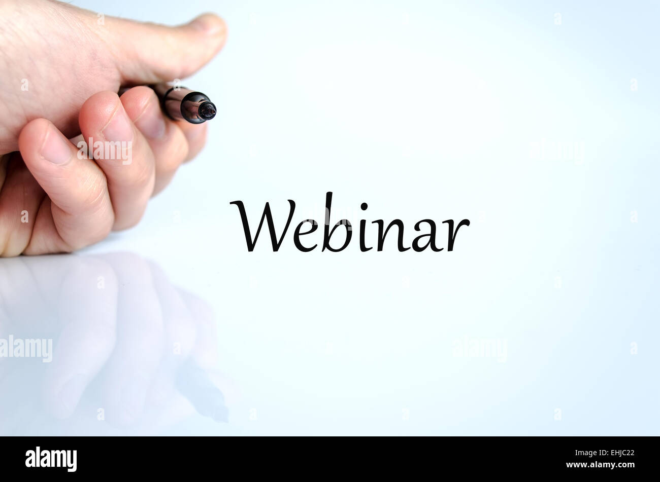 Pen in the hand isolated over white background Webinar Stock Photo