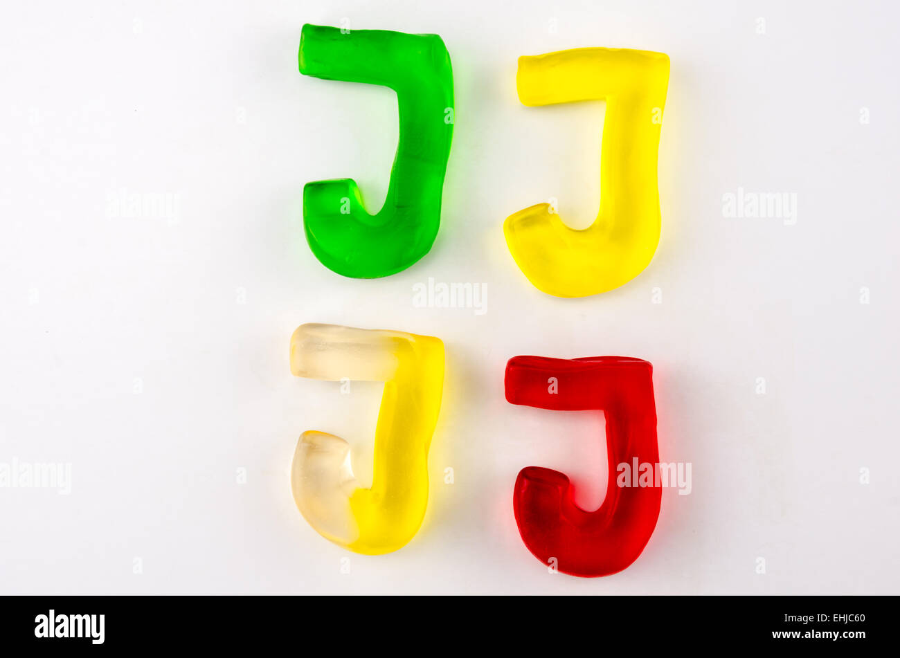 A set of four gummy letters in the shape of J isolated on white Stock Photo