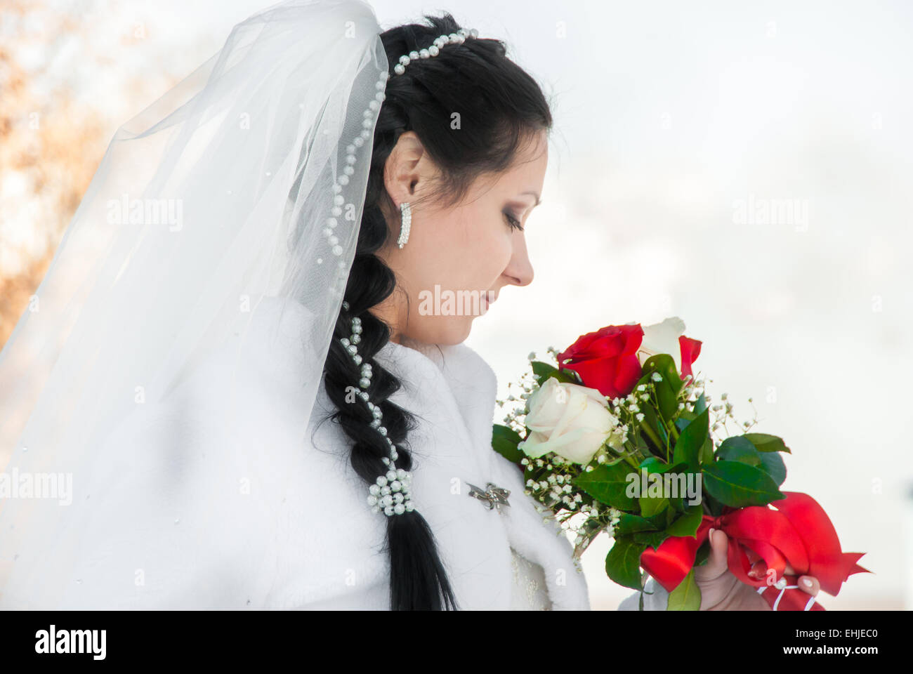 Portrait of the bride with a bunch of flowers, in a wedding dress Stock ...