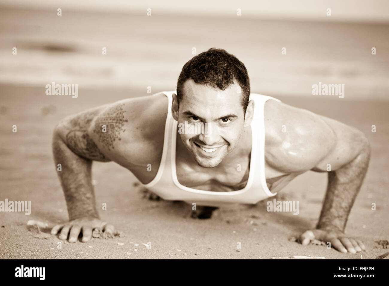 Male exercising on the beach Stock Photo Alamy