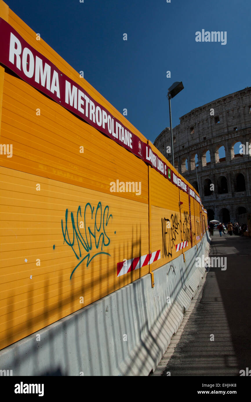 Fence around building site of  third metro line (Line C) in Rome at the Colosseum Stock Photo