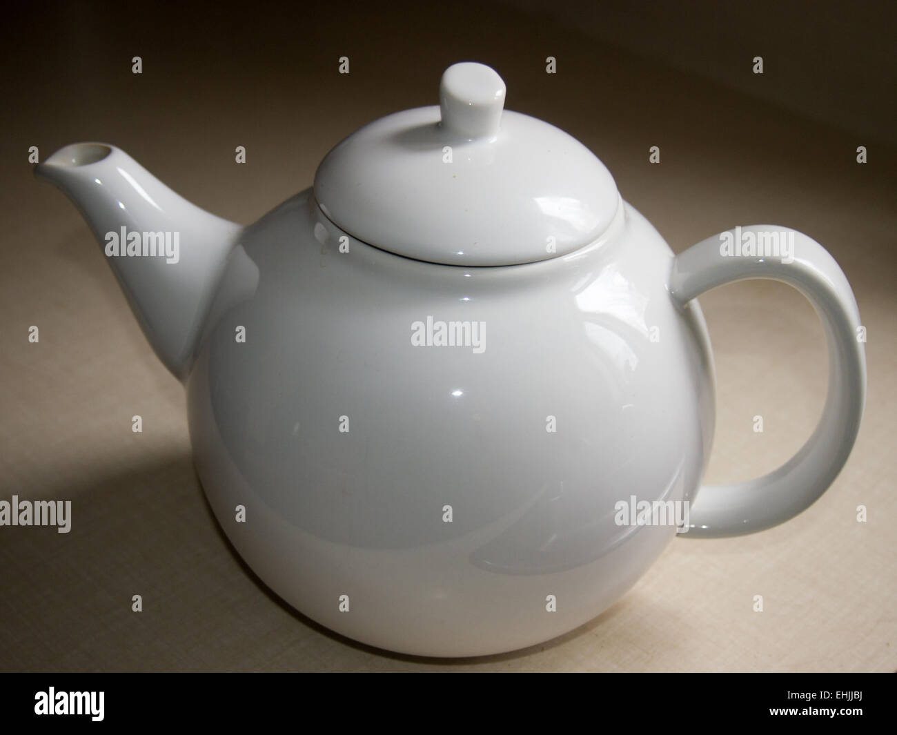 Simple white teapot Stock Photo