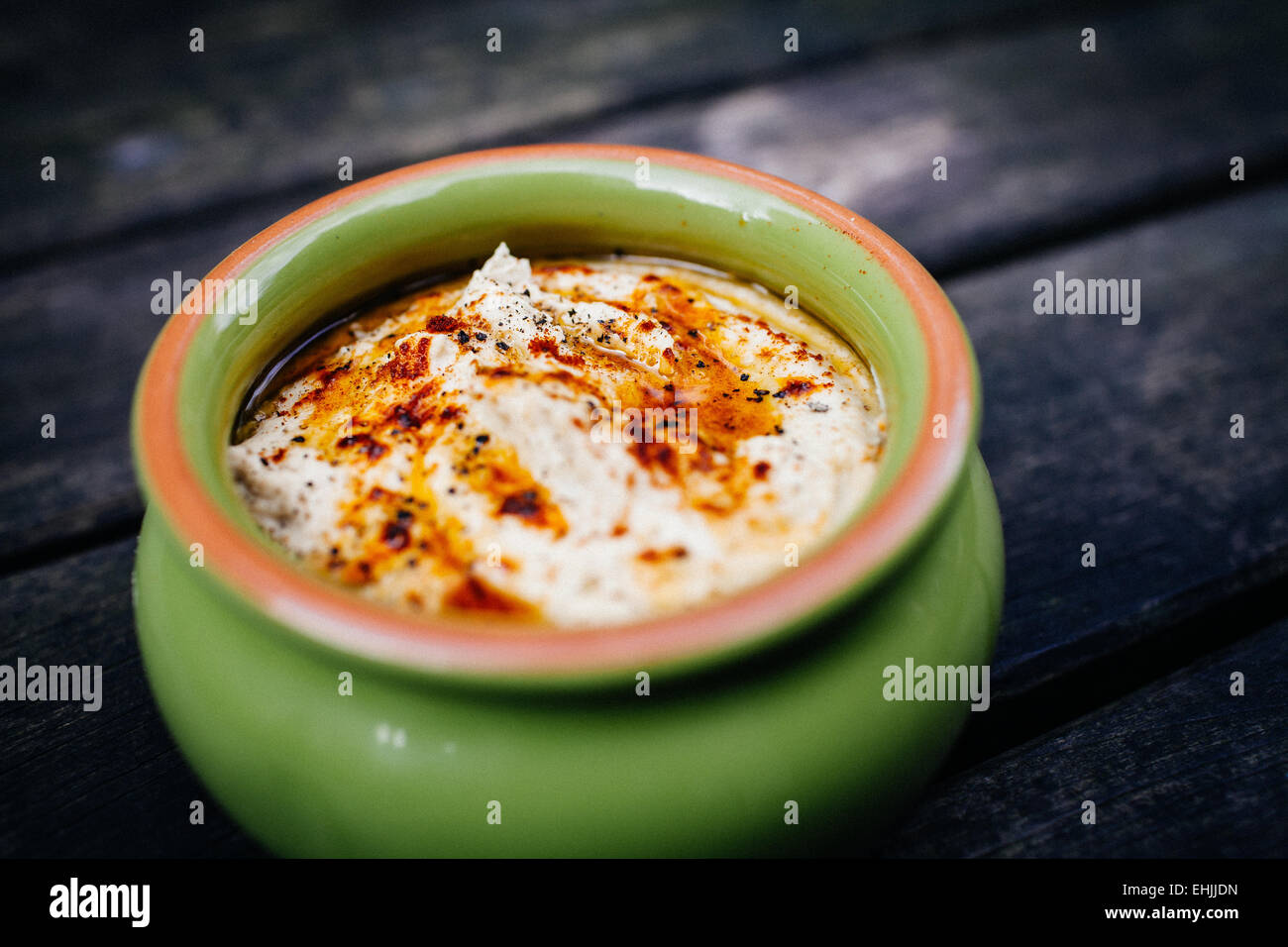 Freshly-made bowl of nutritious hummus. Stock Photo