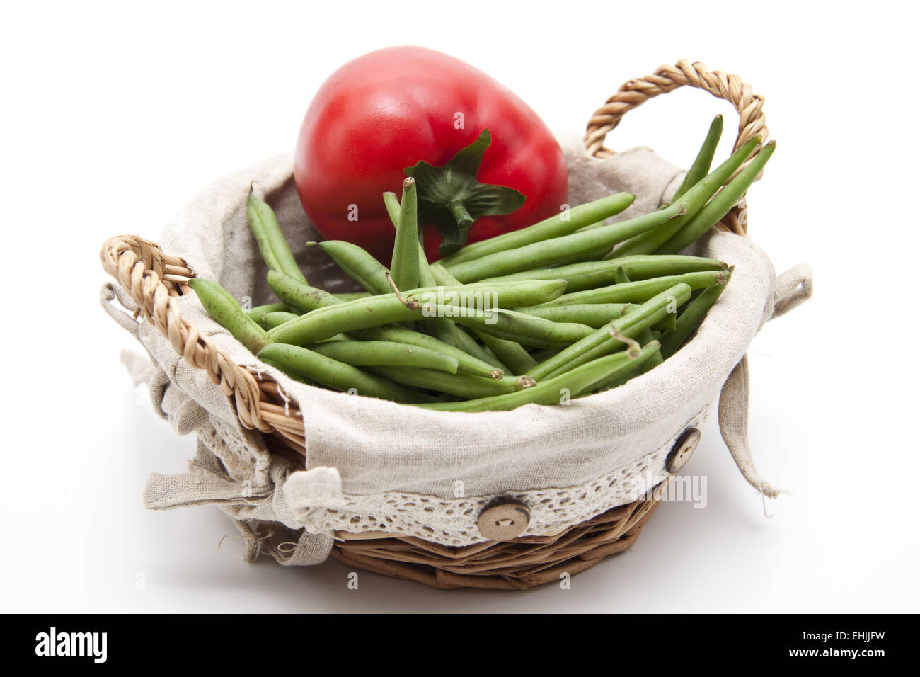 Tomato with beans in the basket Stock Photo