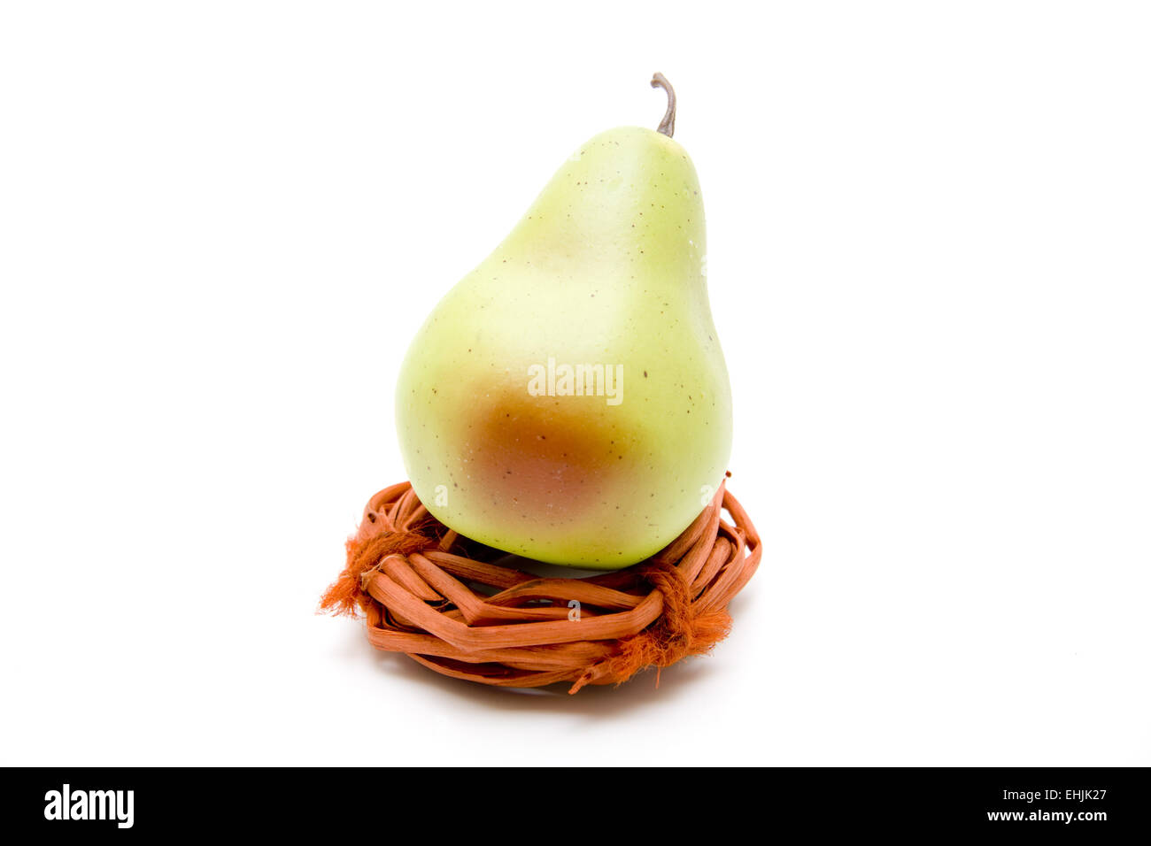 Pear on straw ring Stock Photo Alamy