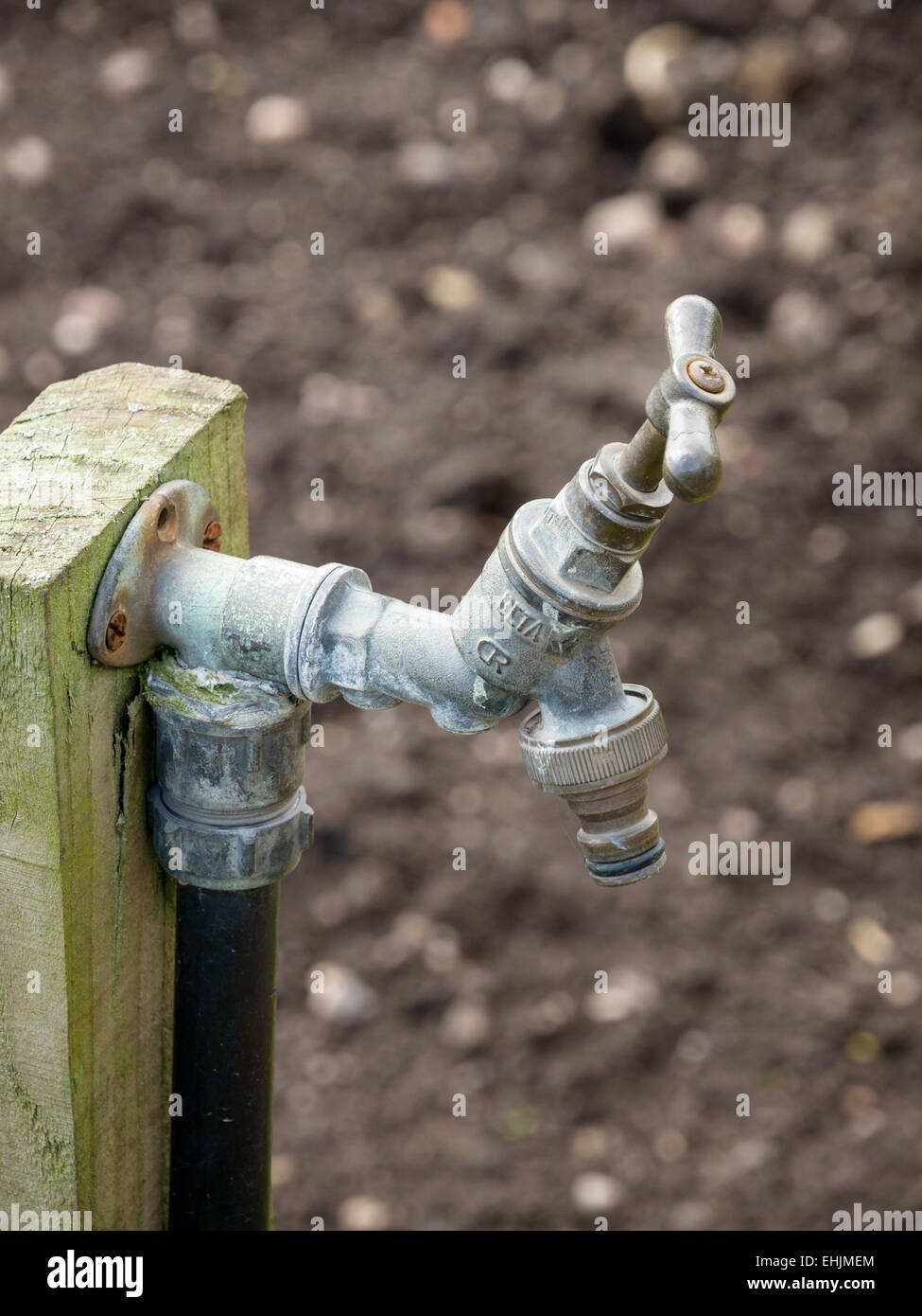 Old outdoor metal garden water tap detail Stock Photo