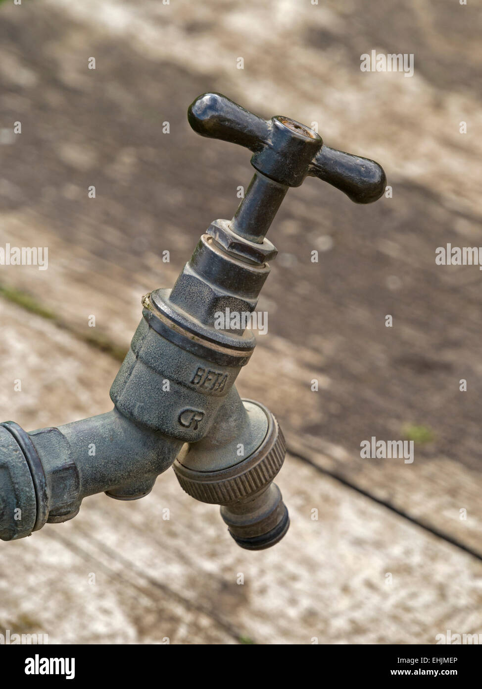 Old outdoor metal garden water tap detail Stock Photo