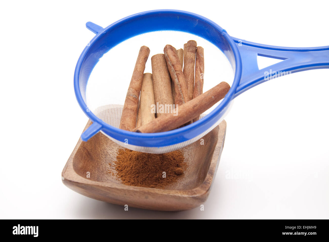 Cinnamon sticks in the culinary sieve Stock Photo