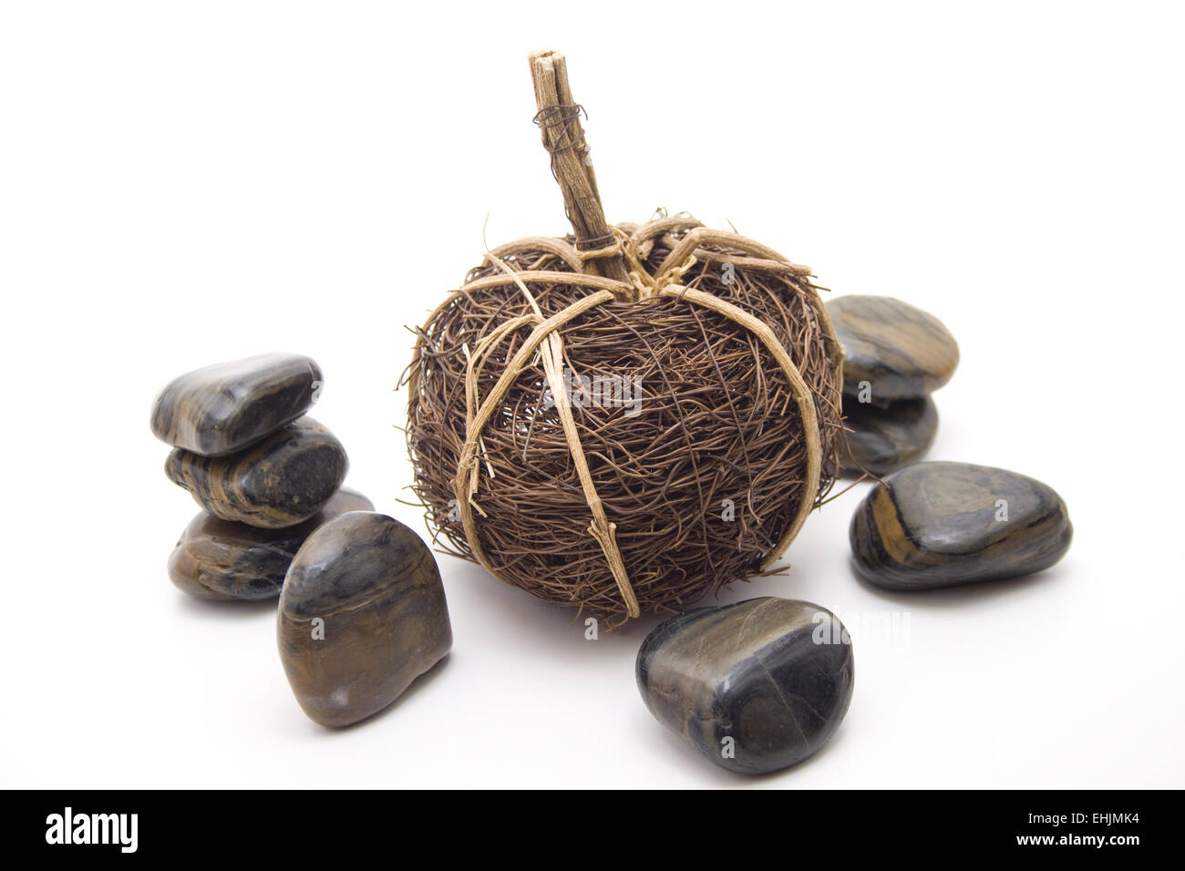 Straw sphere and stones Stock Photo