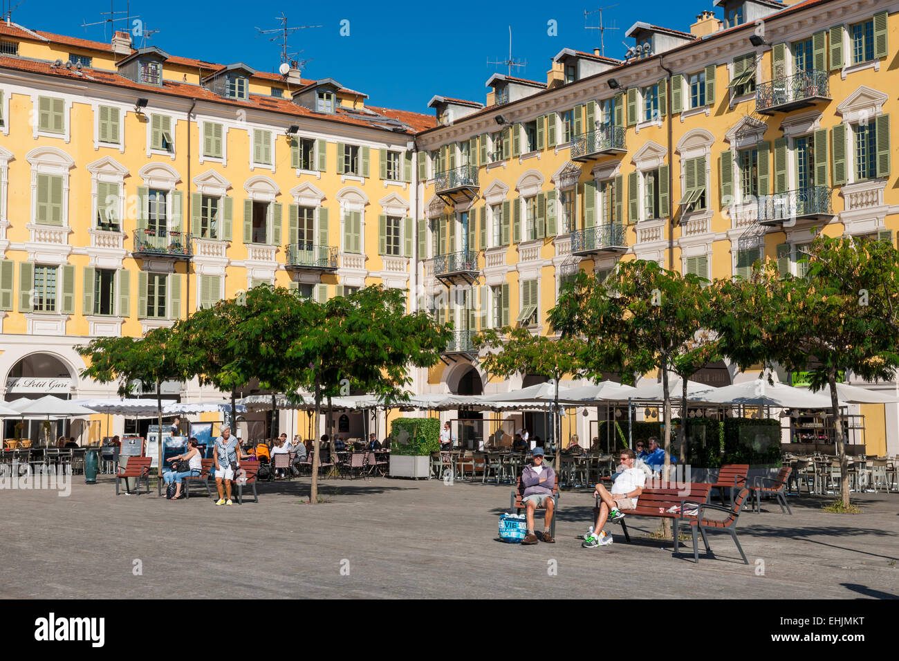 NICE, FRANCE - OCTOBER 2, 2014: Restaurant patios at Place Garibaldi, one of the oldest and largest squares in the city. Stock Photo