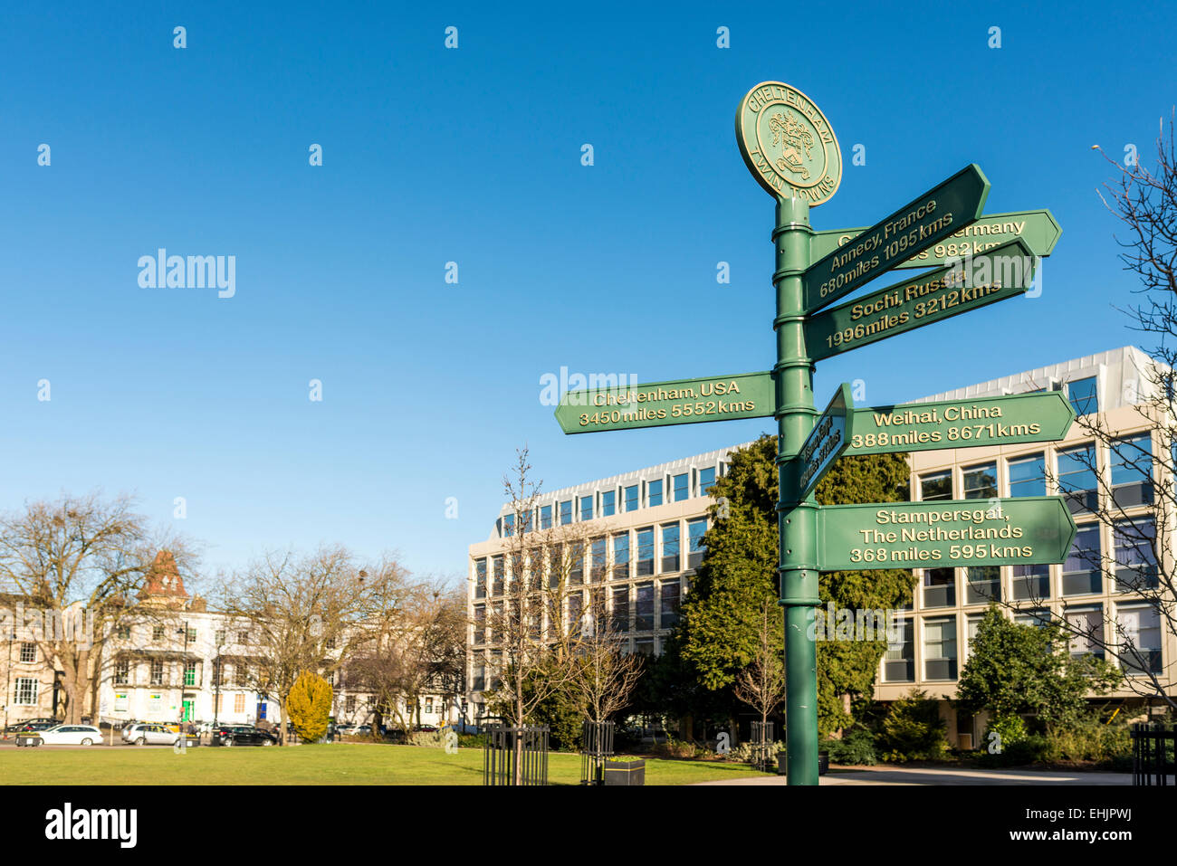 A signpost in the Imperial Gardens of Cheltenham, Gloucestershire pointing to towns which are